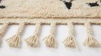 Zigzag Bloom Beni Ourain rug fringe detail on white studio background