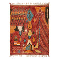 Rust and amber Boujaad rug with teal accents and black tribal motifs, flat lay