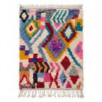Kaleidoscope Boujaad rug — ivory field with playful multicolor Berber motifs, flat lay