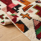 Natural wool Moroccan runner rug with fringe detail handwoven by artisans
