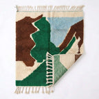 Abstract Calm Mrirt rug — rug folded showing wool thickness