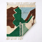 Abstract Calm Mrirt rug — rug folded showing wool thickness
