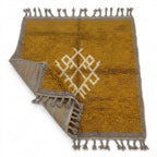 Amber Medallion Mrirt rug — folded corner showing plush pile depth