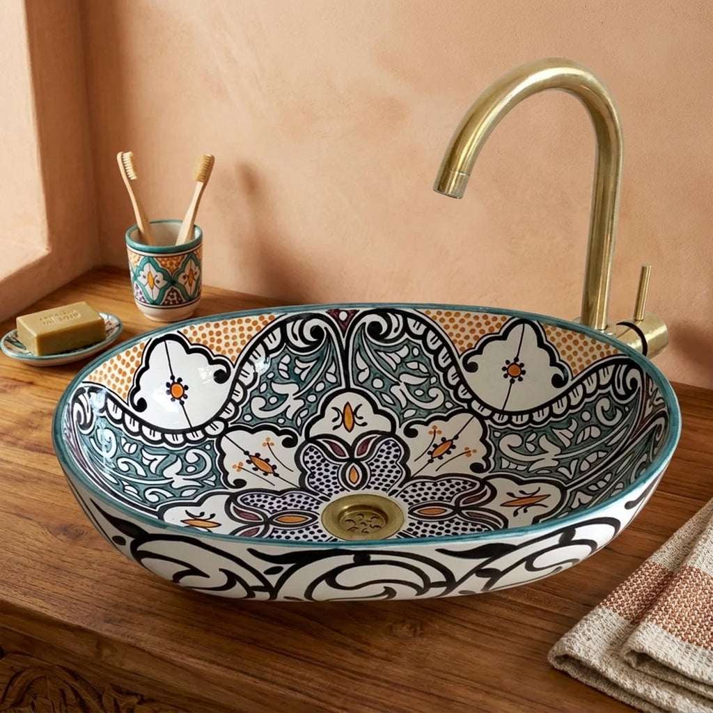 Amber and Teal Heritage Moroccan ceramic vessel sink styled on a bathroom counter in a Moroccan-inspired setting