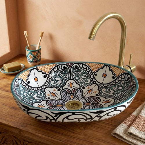 Amber and Teal Heritage Moroccan ceramic vessel sink styled on a bathroom counter in a Moroccan-inspired setting