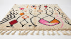 Zigzag Bloom Beni Ourain rug side view on white studio background