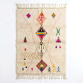 Berber X Azilal rug, handwoven wool with central diamonds, crosses and small multicolor symbols, flat lay top view
