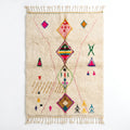 Berber X Azilal rug, handwoven wool with central diamonds, crosses and small multicolor symbols, flat lay top view