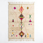 Berber X Azilal rug, handwoven wool with central diamonds, crosses and small multicolor symbols, flat lay top view