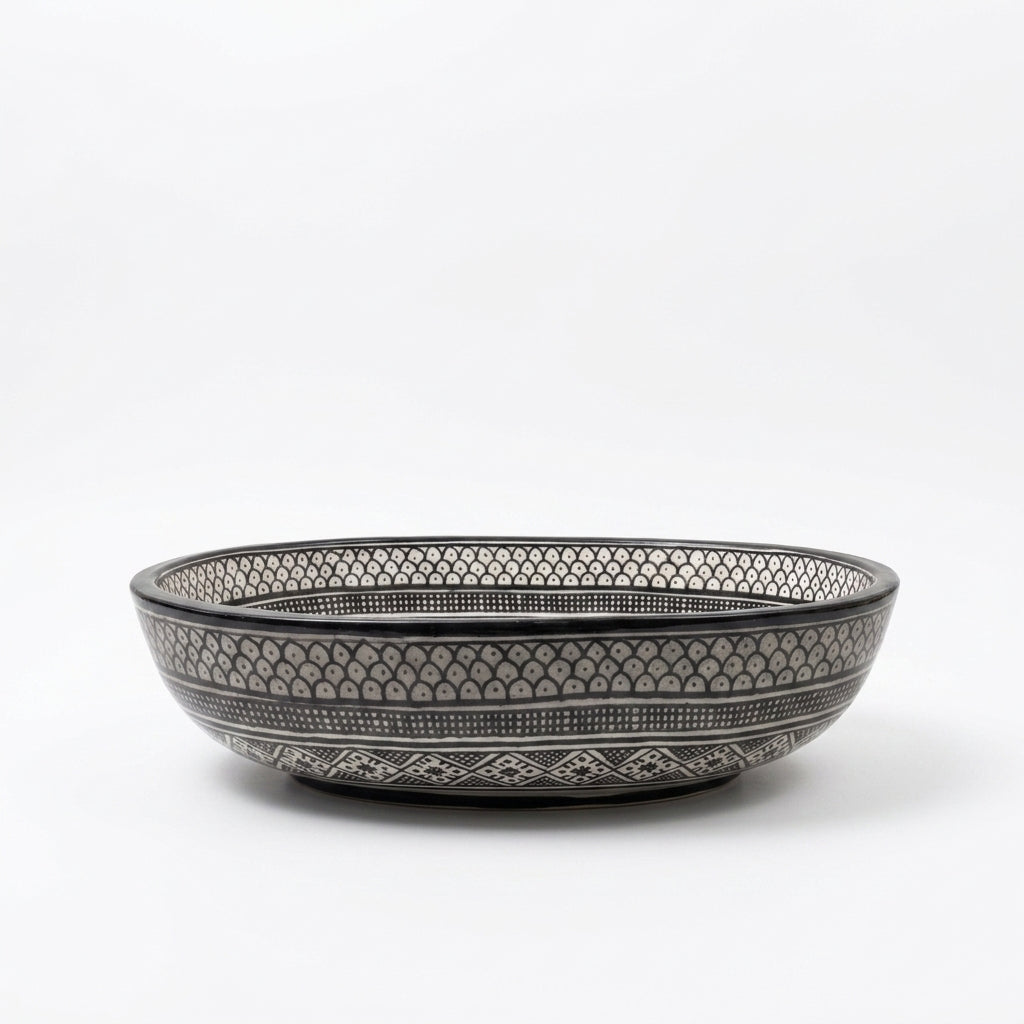 Black and Ivory Fassi Moroccan ceramic sink - side angle of monochrome patterned basin