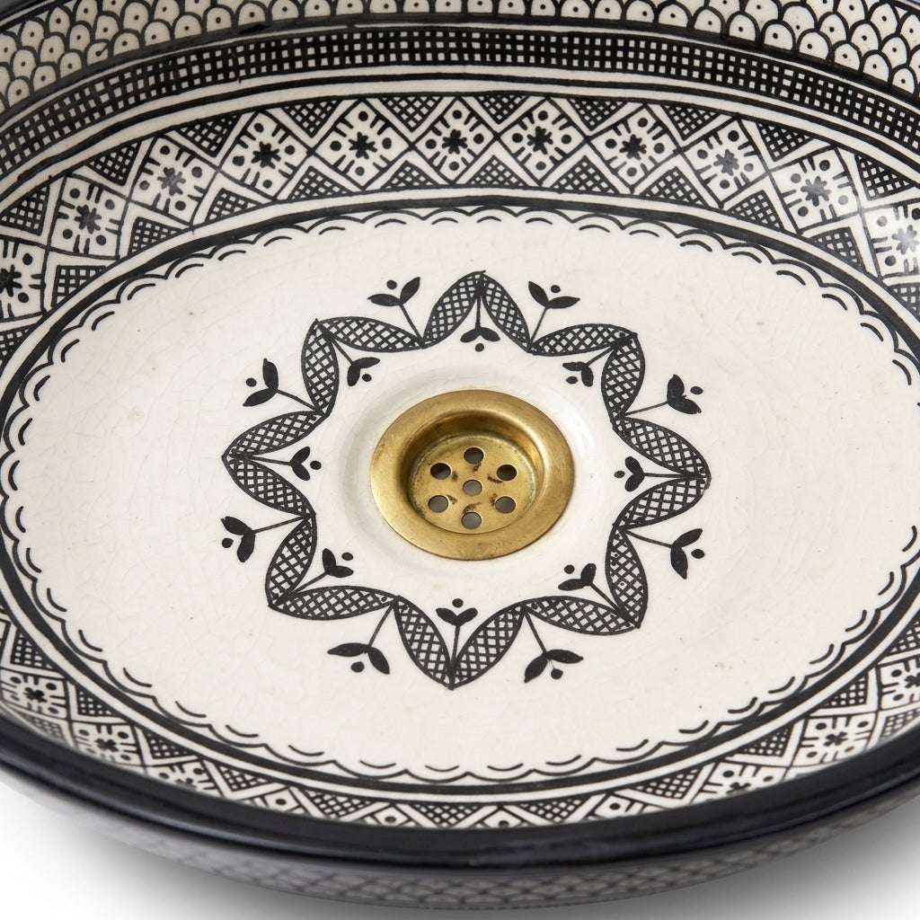 Black and Ivory Fassi Moroccan ceramic sink - close-up of hand-painted surface texture