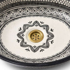 Black and Ivory Fassi Moroccan ceramic sink - close-up of hand-painted surface texture
