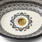Black and Ivory Fassi Moroccan ceramic sink - close-up of hand-painted surface texture