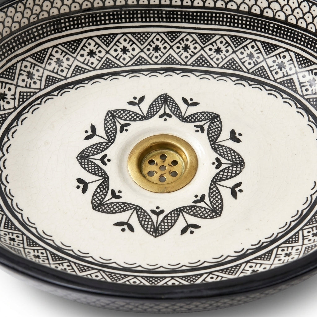 Black and Ivory Fassi Moroccan ceramic sink - close-up of hand-painted surface texture