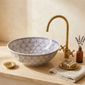 Blue Fan Arches Moroccan ceramic vessel sink styled on a bathroom counter in a Moroccan-inspired setting