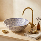 Blue Fan Arches Moroccan ceramic vessel sink styled on a bathroom counter in a Moroccan-inspired setting