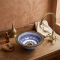 Brass Rim Fessi Moroccan ceramic vessel sink styled on a bathroom counter in a Moroccan-inspired setting