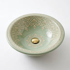 Celadon Trellis Moroccan ceramic sink - studio view of green damask basin