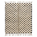 Checkerboard Beni Ourain rug, handwoven wool with an ivory and black checkerboard pattern, flat lay top view