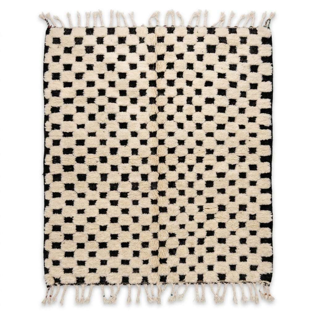 Checkerboard Beni Ourain rug, handwoven wool with an ivory and black checkerboard pattern, flat lay top view