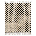 Checkerboard Beni Ourain rug, handwoven wool with an ivory and black checkerboard pattern, flat lay top view