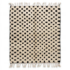 Checkerboard Beni Ourain rug, handwoven wool with an ivory and black checkerboard pattern, flat lay top view