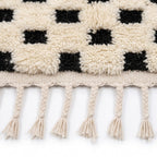 Checkerboard Beni Ourain rug — hand-knotted fringe detail close-up