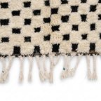 Checkerboard Beni Ourain rug — hand-knotted fringe detail close-up