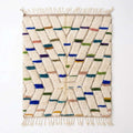 Confetti Dash Azilal rug, handwoven wool with blue, green, teal, mustard and pink dashes, flat lay top view