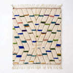 Confetti Dash Azilal rug, handwoven wool with blue, green, teal, mustard and pink dashes, flat lay top view