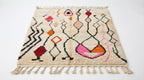 Zigzag Bloom Beni Ourain rug full view at an angle on white studio background