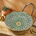 Gilded Peacock Bloom Moroccan ceramic vessel sink styled on a bathroom counter in a Moroccan-inspired setting