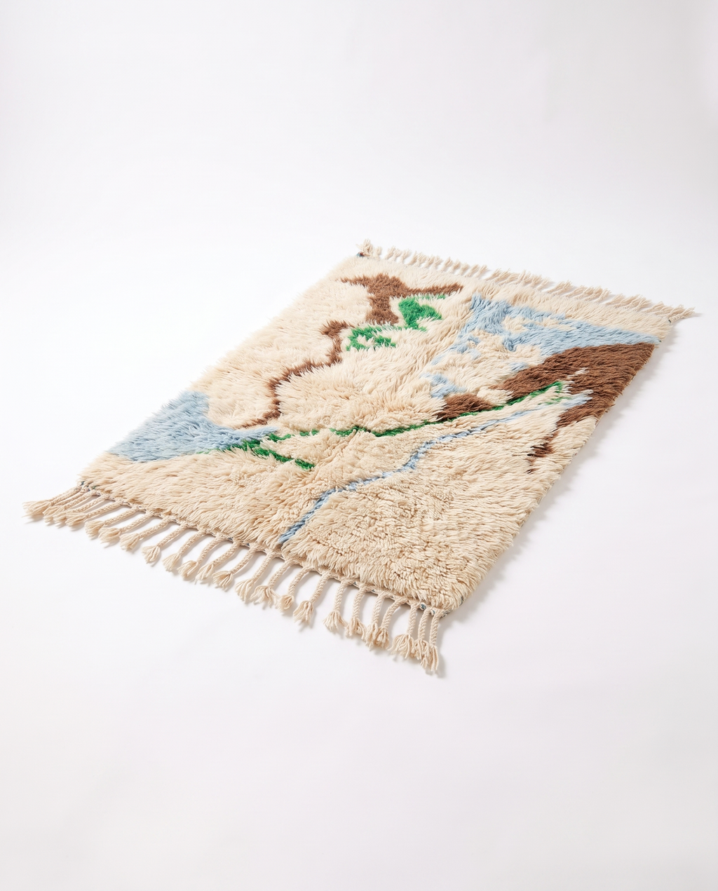 Premium cream Mrirt rug full view at an angle on white studio background