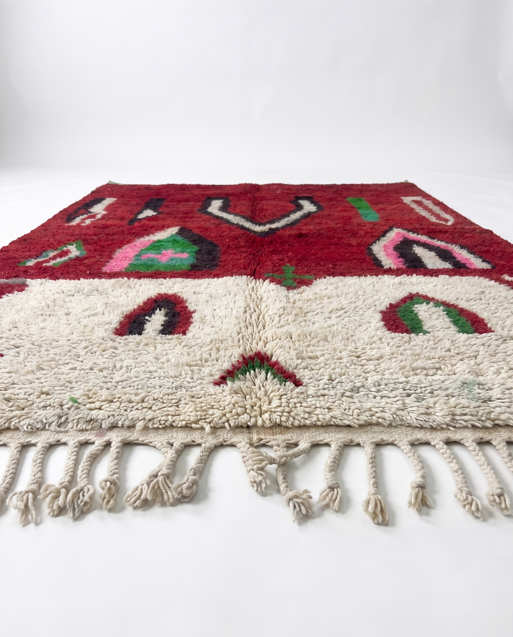 Crimson Boujaad rug side view showing pile height on white studio background