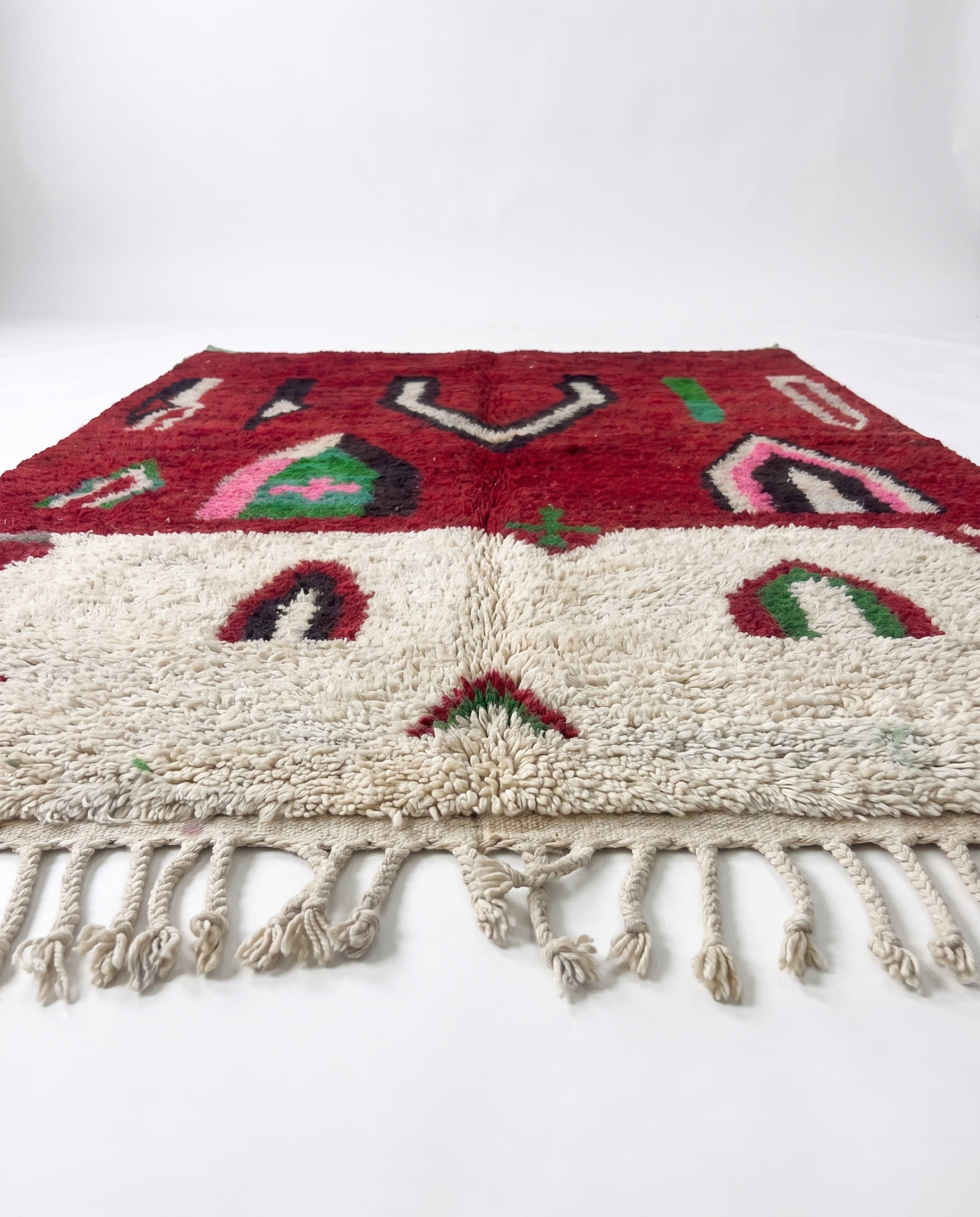 Crimson Boujaad rug side view showing pile height on white studio background