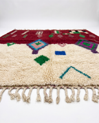 Burgundy and ivory Boujaad rug side view on white studio background