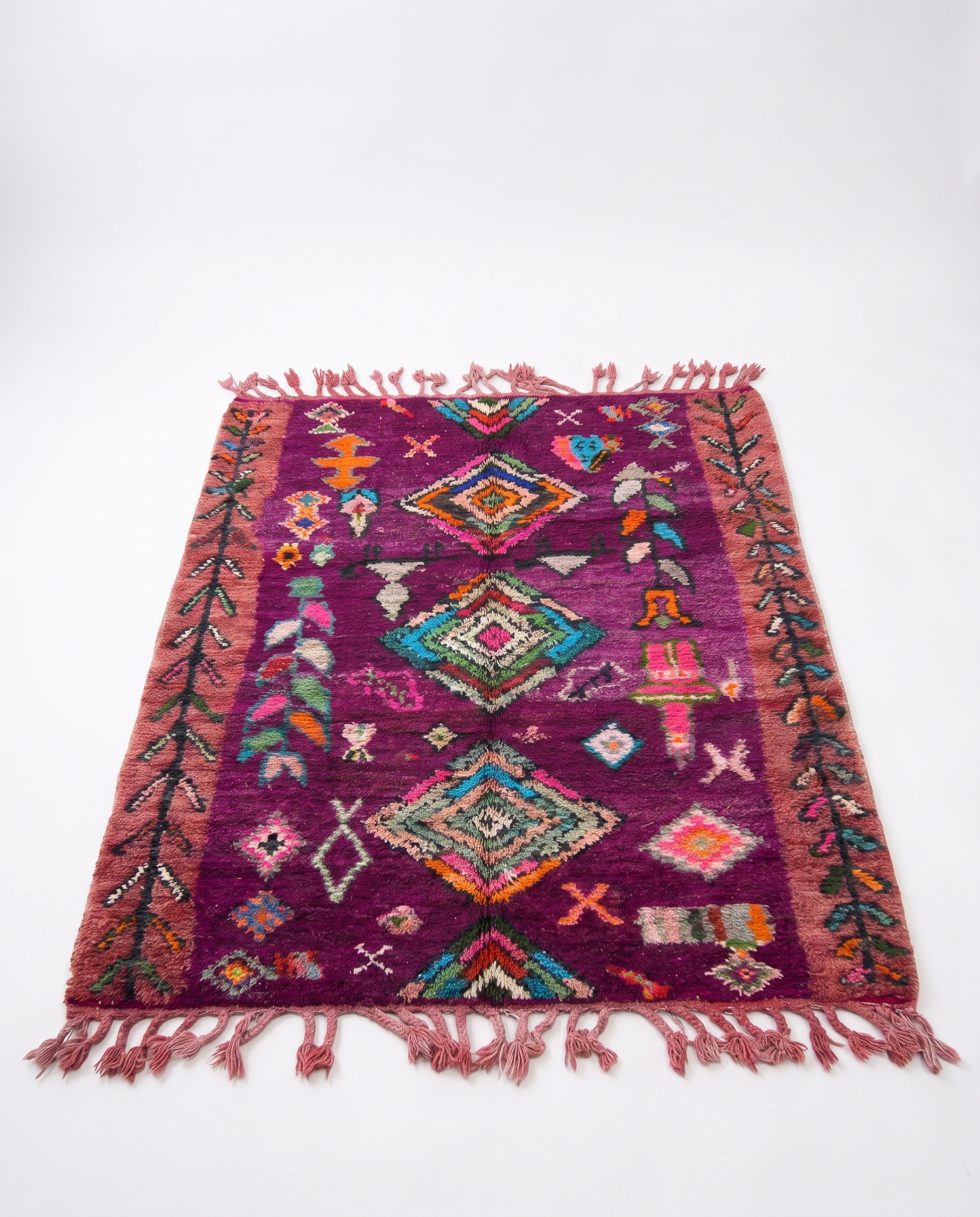 Purple Boujaad rug full view at an angle on white studio background