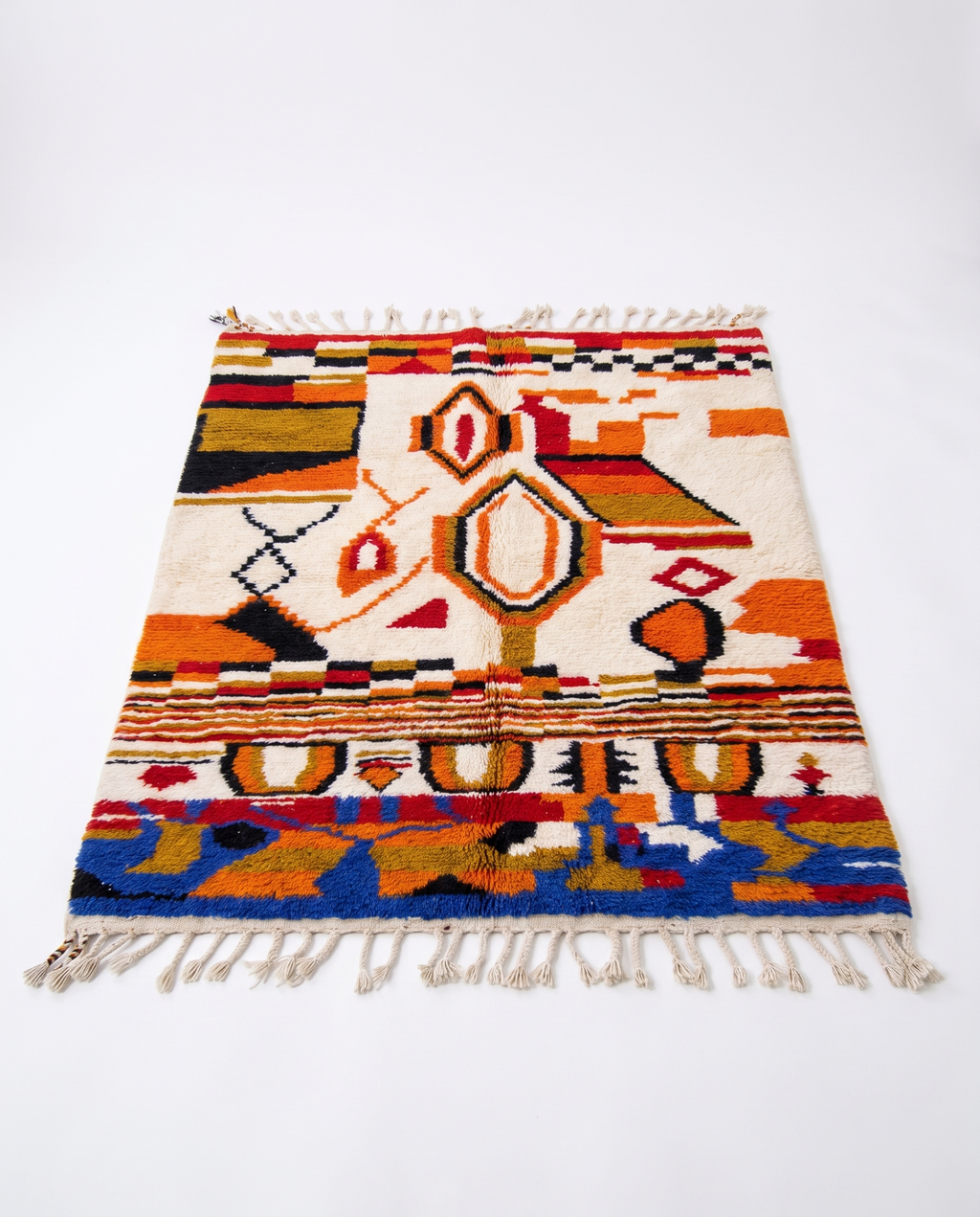 Saffron and ivory Boujaad rug full view at an angle on white studio background