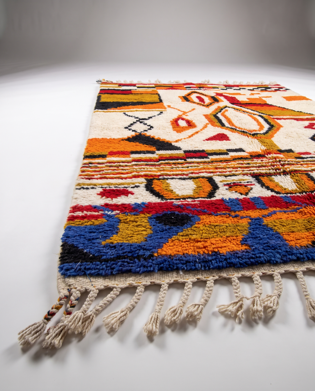 Saffron and ivory Boujaad rug side view on white studio background
