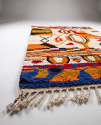 Saffron and ivory Boujaad rug side view on white studio background