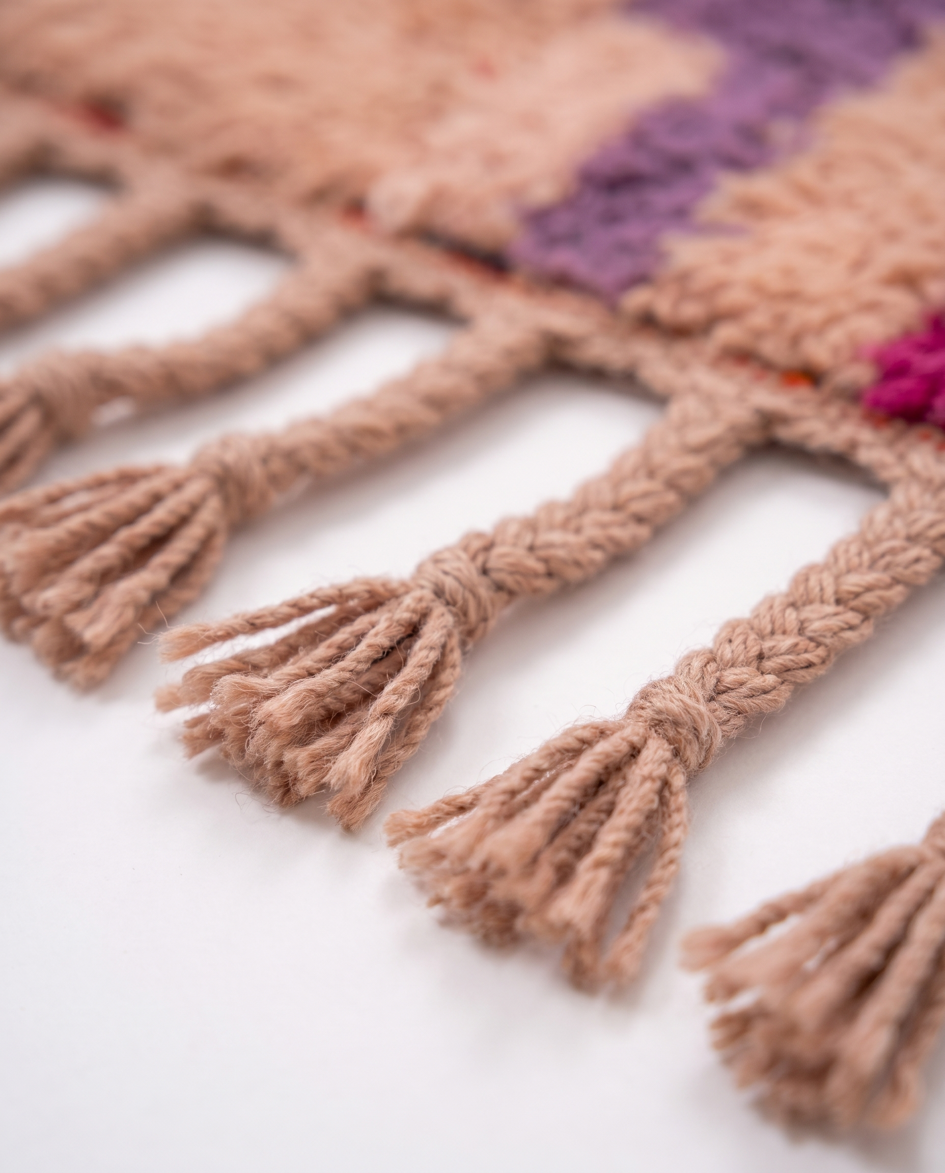 Blush terracotta Boujaad rug fringe detail on white studio background