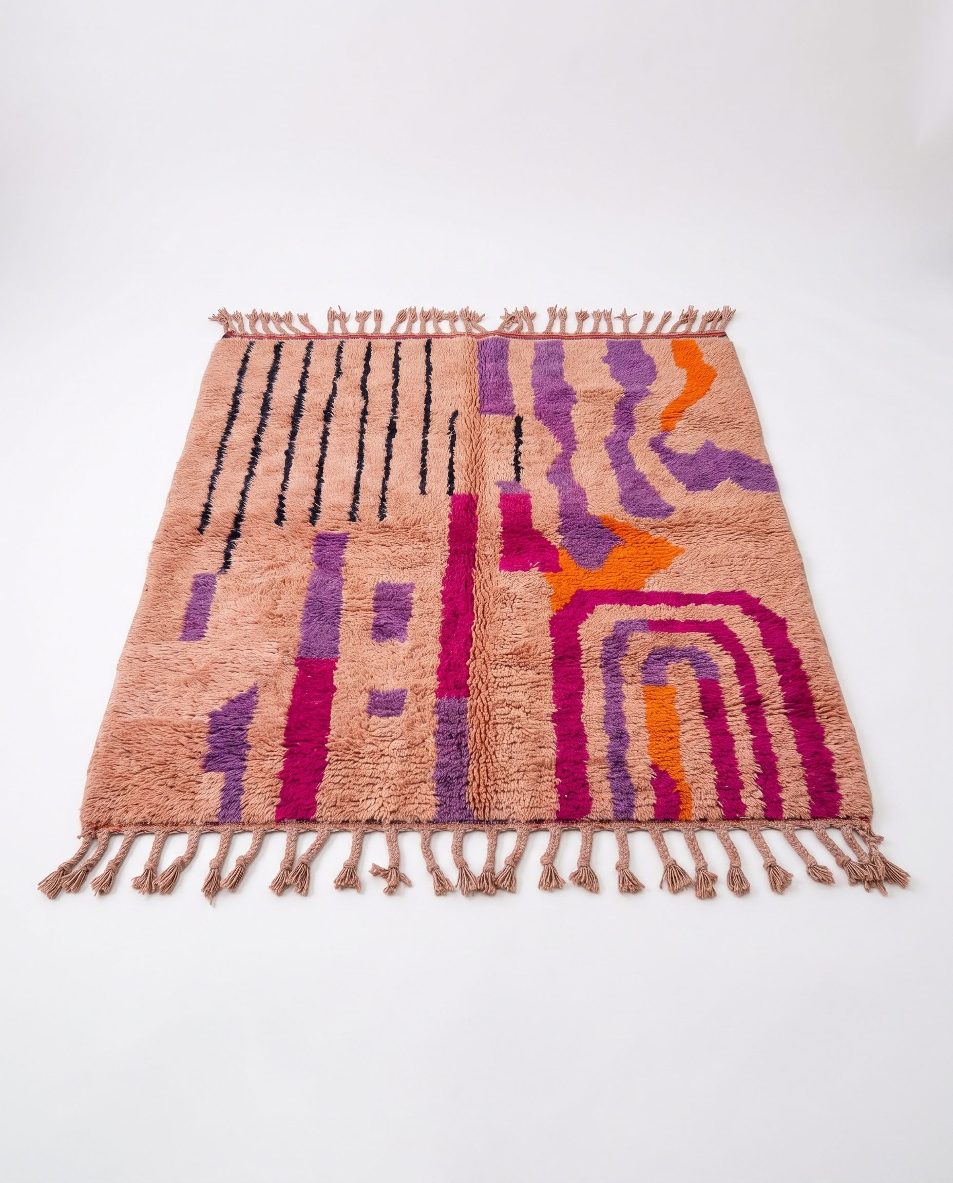 Blush terracotta Boujaad rug full view at an angle on white studio background