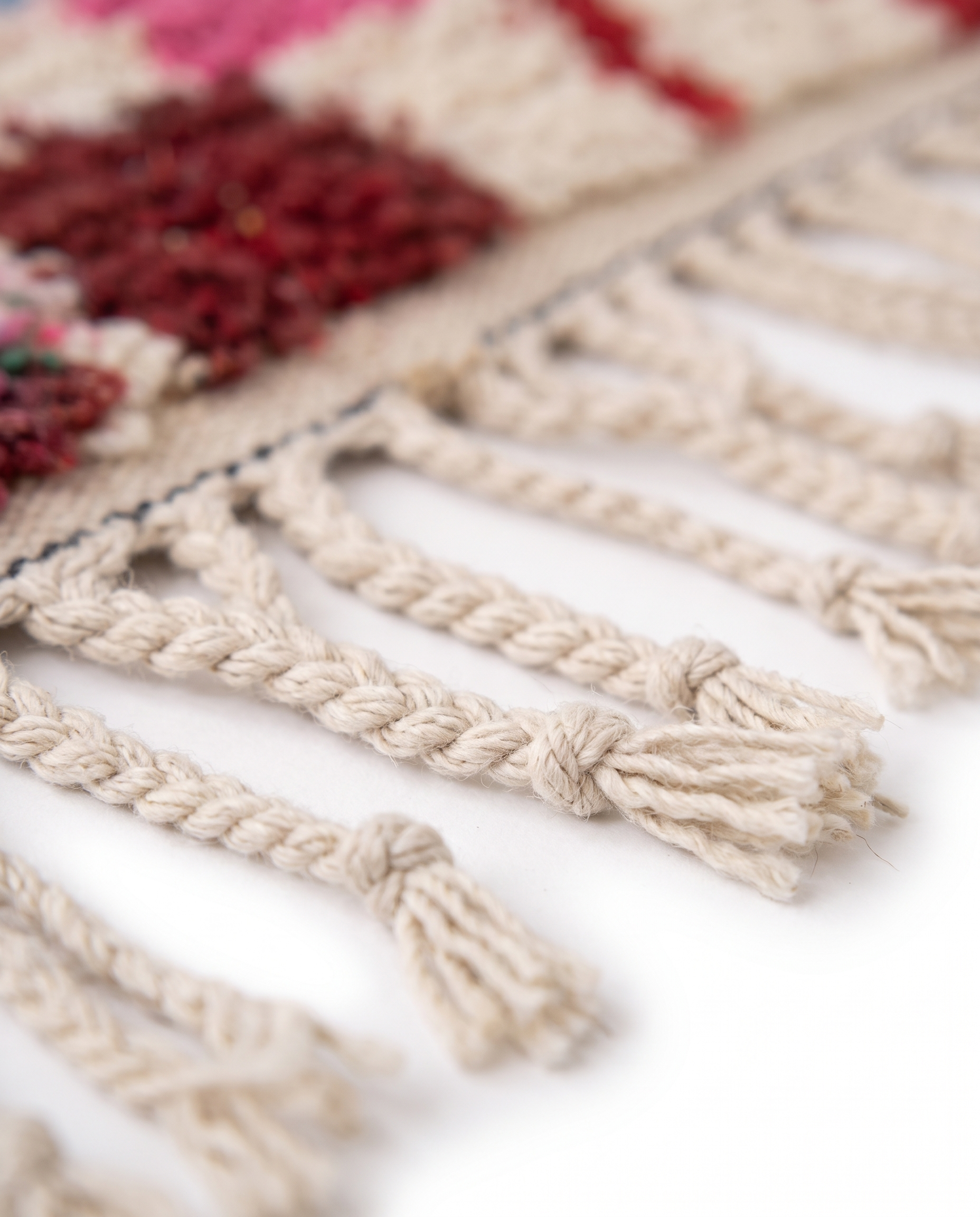 Kaleidoscope Boujaad rug fringe detail on white studio background