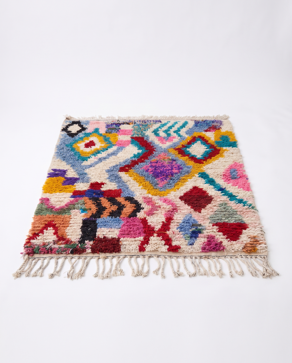 Kaleidoscope Boujaad rug full view at an angle on white studio background