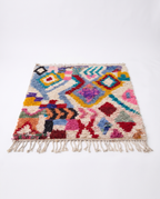 Kaleidoscope Boujaad rug full view at an angle on white studio background