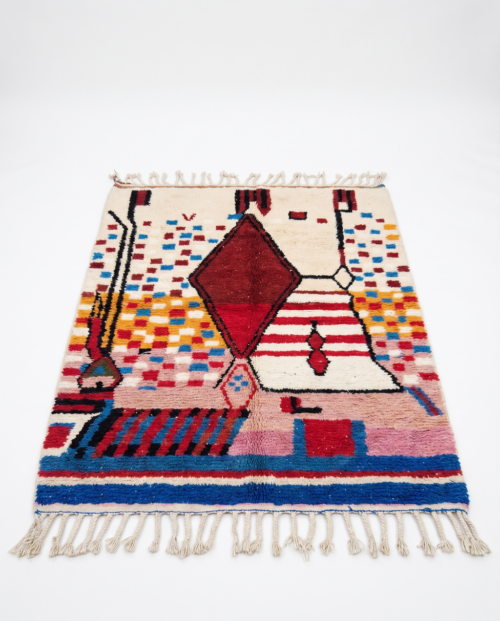 Garnet diamond Boujaad rug full view at an angle on white studio background