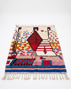 Garnet diamond Boujaad rug full view at an angle on white studio background