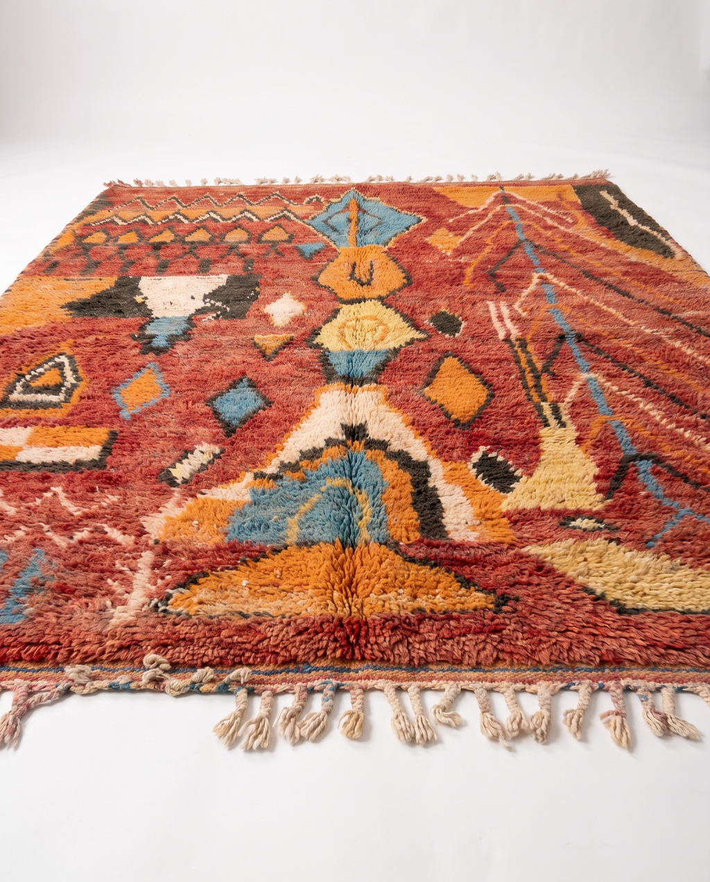 Rust and amber Boujaad rug side view on white studio background