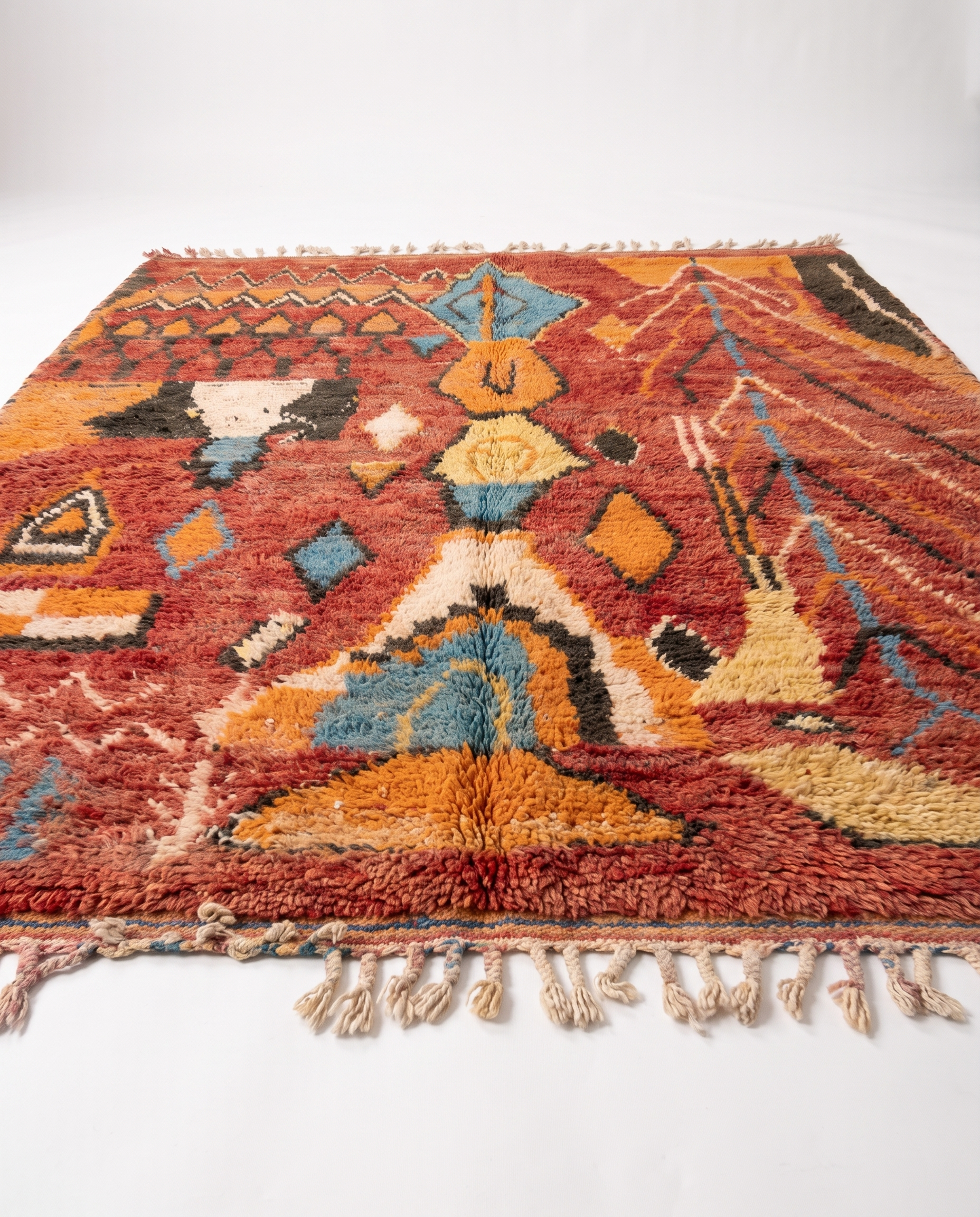 Rust and amber Boujaad rug side view on white studio background