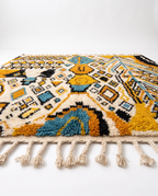 Mustard and teal Boujaad rug side view on white studio background